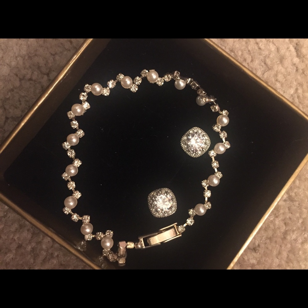 cubic zirconia studs and a pearl bracelet